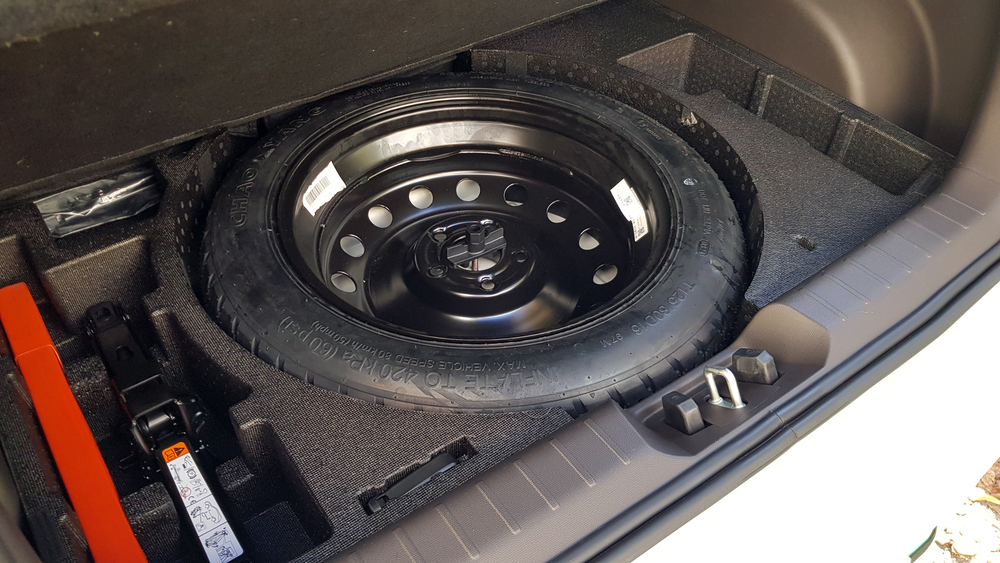 Electric city car JAC E30X in Belarus test spare tire rolling