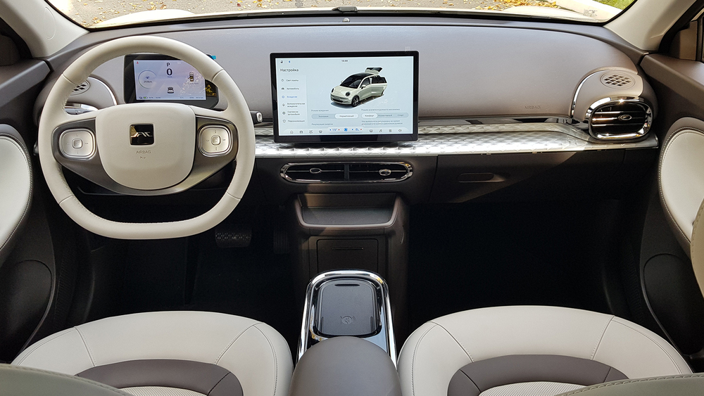 Electric city car JAC E30X in Belarus test salon interior first row dashboard