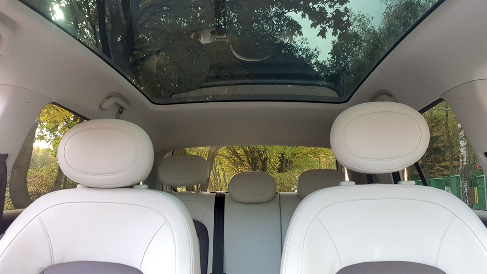 Electric city car JAC E30X in Belarus test salon interior panoramic roof glazing