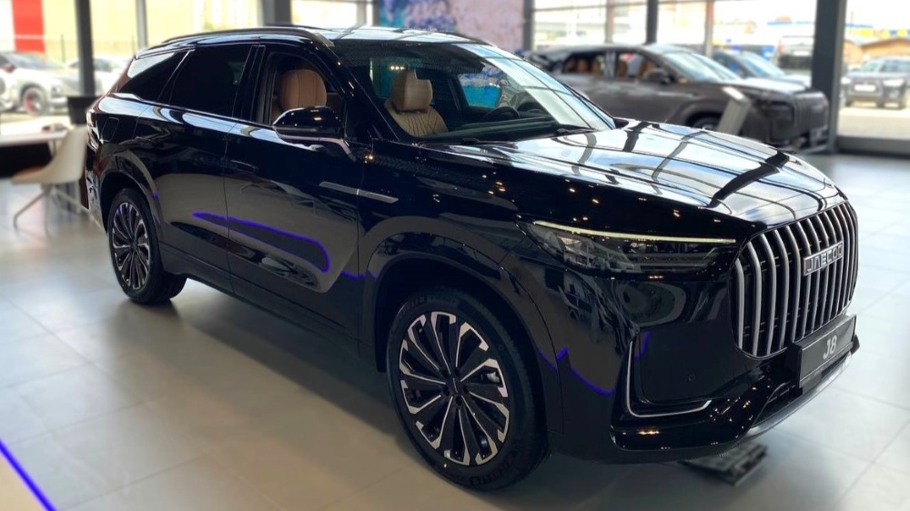 JAECOO J8 on the front side of the dealer new in the car dealership to buy on the side